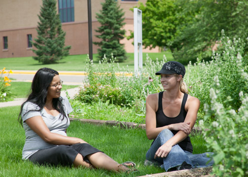 students sitting on lanw