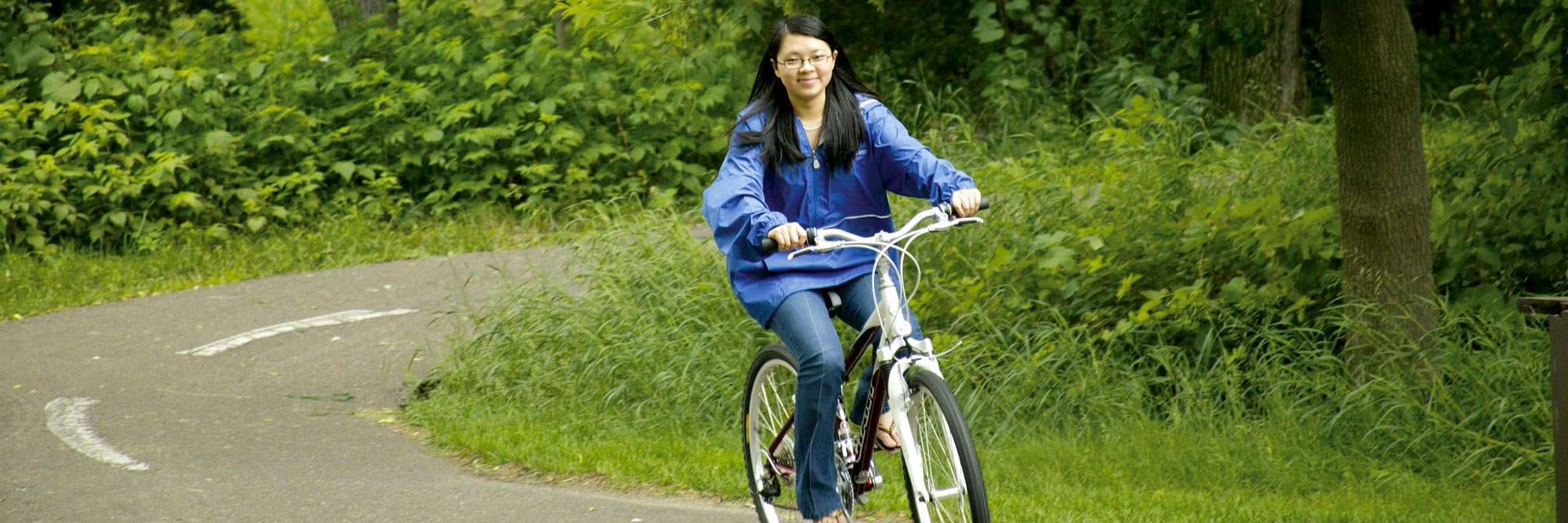 student on bike trail