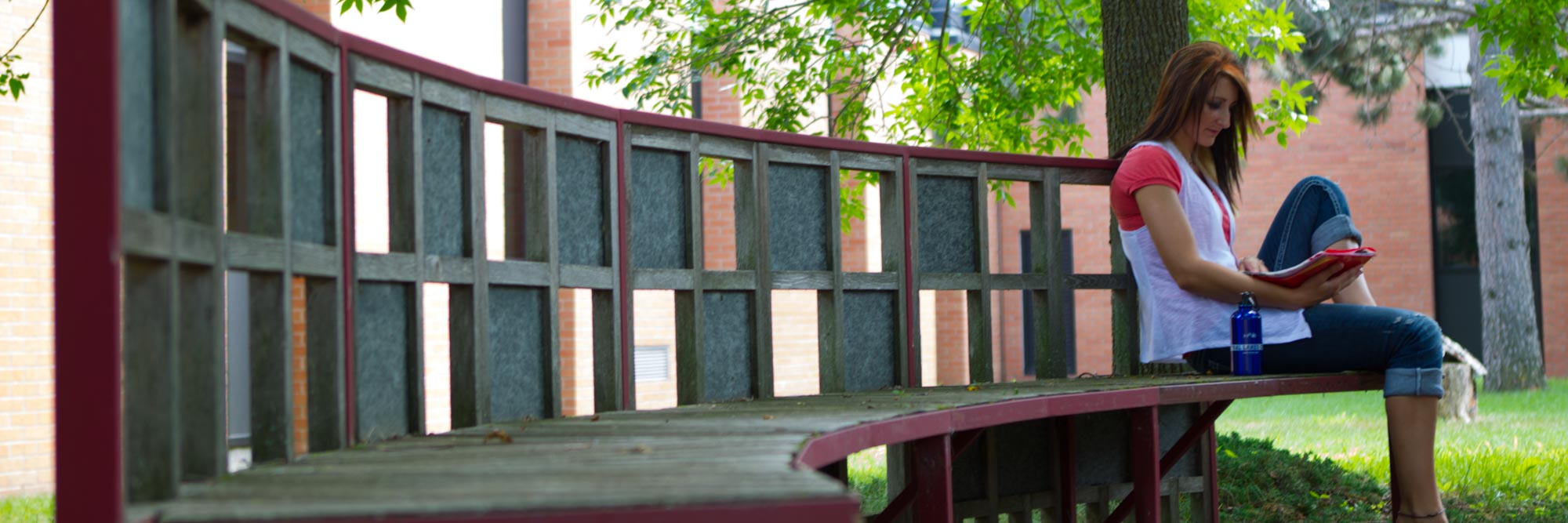 student sitting on bench