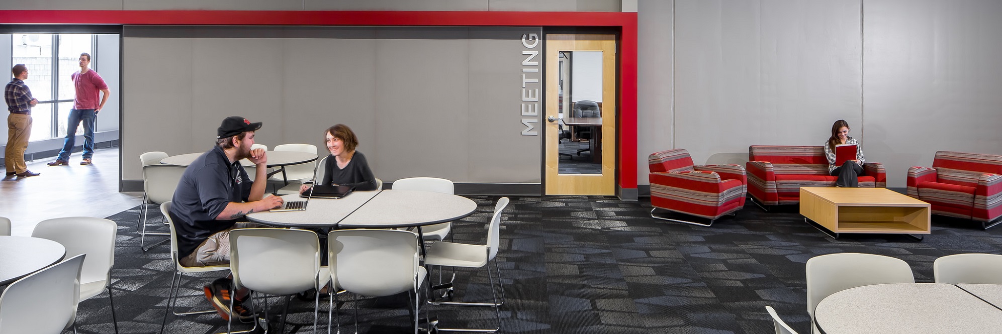 staples campus interior people sitting and talking