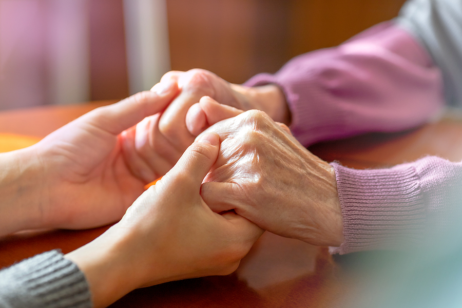 Elderly hands helping