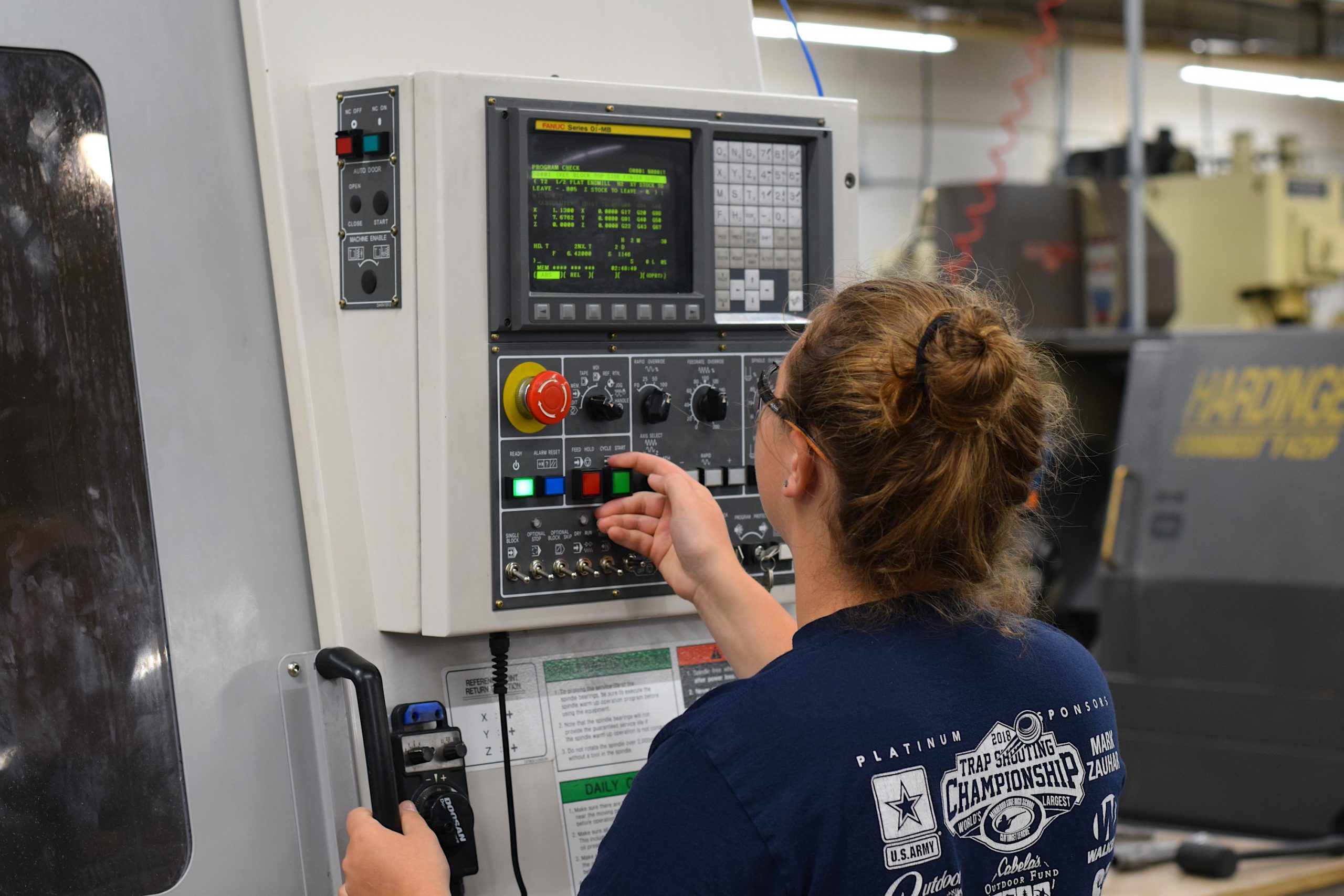 student on cnc machine