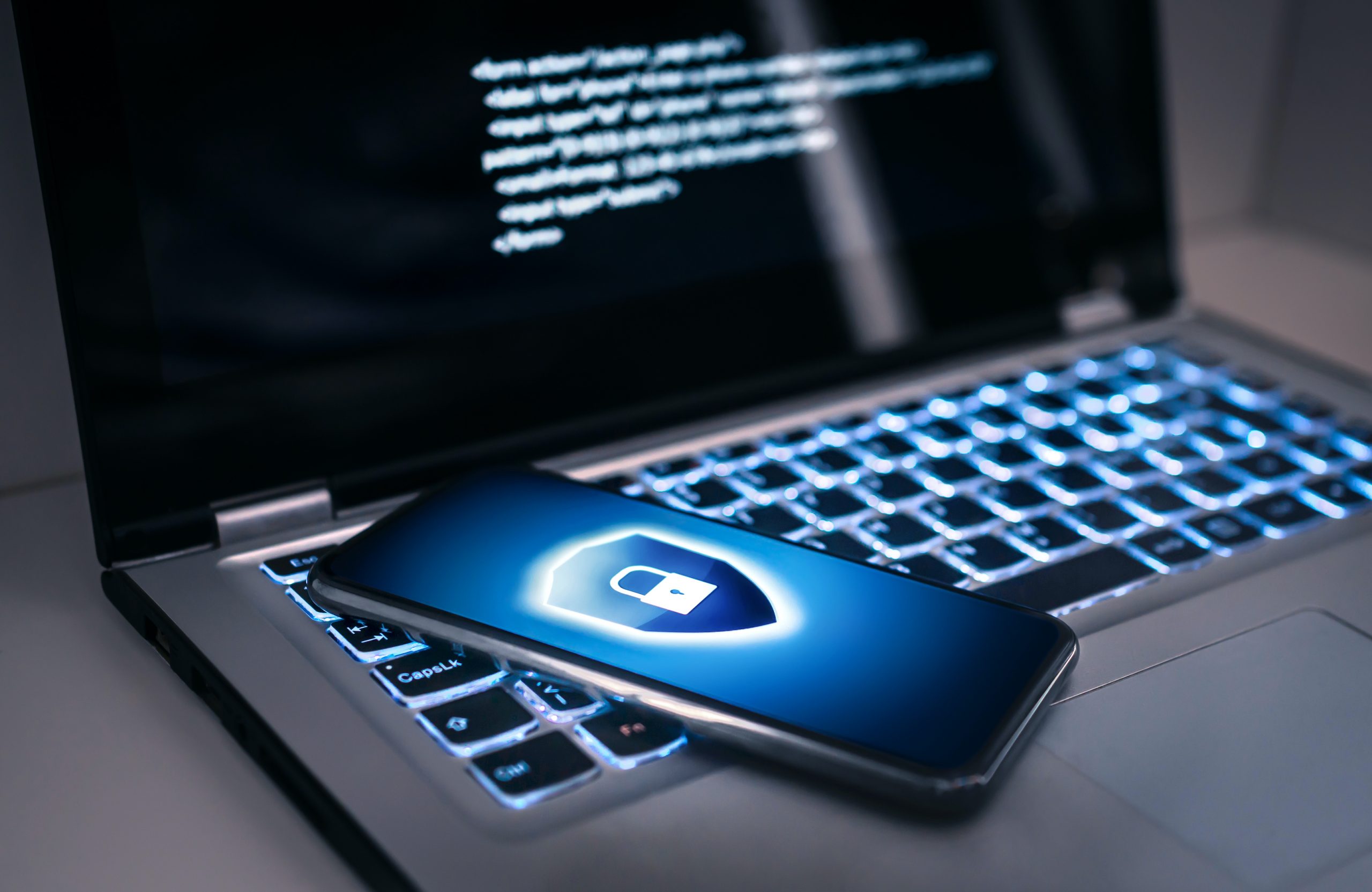 Phone Lock To Protect From Cyber Scam, Online Data Fraud Or Identity Theft. Laptop With Hacker Virus
