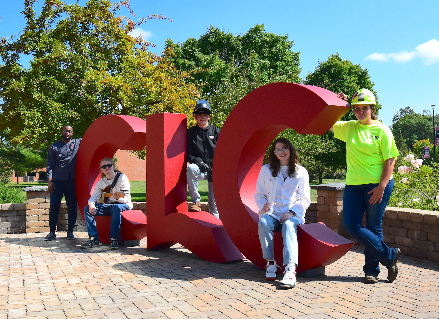 CLC Students in photo with large letters