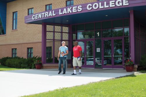 students walking out door