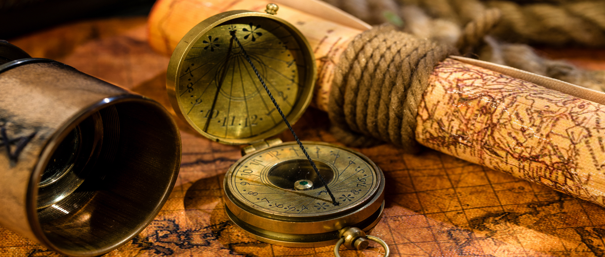 Old Vintage Retro Compass And Spyglass On Ancient World Map